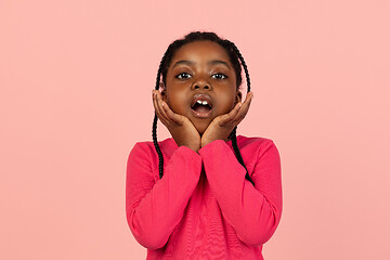 Image showing Handsome african little girl portrait isolated on pink studio background with copyspace