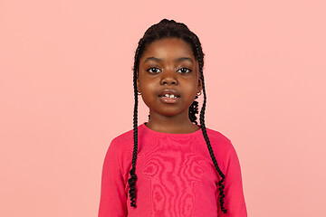 Image showing Handsome african little girl portrait isolated on pink studio background with copyspace