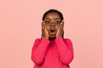 Image showing Handsome african little girl portrait isolated on pink studio background with copyspace