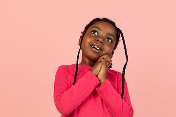 Image showing Handsome african little girl portrait isolated on pink studio background with copyspace