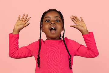 Image showing Handsome african little girl portrait isolated on pink studio background with copyspace