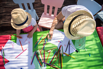 Image showing mom and little daughter drawing a colorful pictures