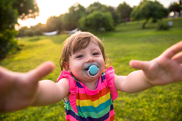 Image showing little girl spending time at backyard