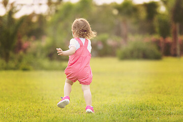 Image showing little girl spending time at backyard