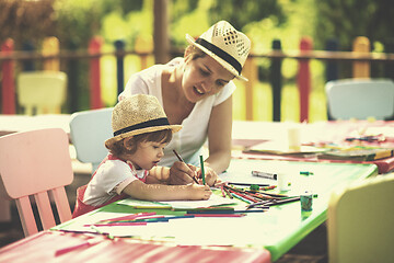 Image showing mom and little daughter drawing a colorful pictures