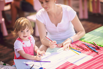 Image showing mom and little daughter drawing a colorful pictures