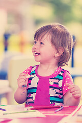 Image showing little girl drawing a colorful pictures