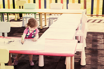 Image showing little girl drawing a colorful pictures