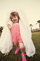 Image showing mother and little daughter playing at backyard