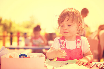 Image showing little girl drawing a colorful pictures