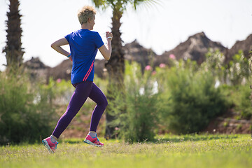 Image showing young female runner training for marathon