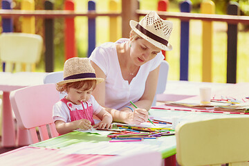 Image showing mom and little daughter drawing a colorful pictures