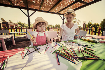 Image showing mom and little daughter drawing a colorful pictures