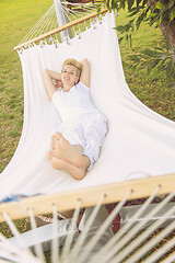 Image showing young woman resting on hammock