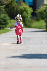 Image showing little girl runing in the summer Park