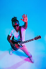 Image showing Young african-american jazz musician playing the guitar