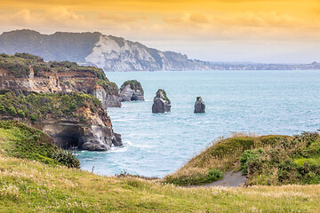 Image showing sea shore rocks and mount Taranaki, New Zealand