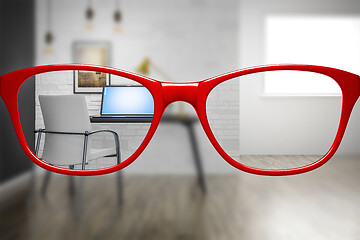 Image showing red glasses with home office sharp and blurred