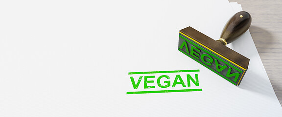 Image showing green stamp vegan on white paper background