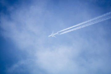 Image showing blue sky with plane in the clouds