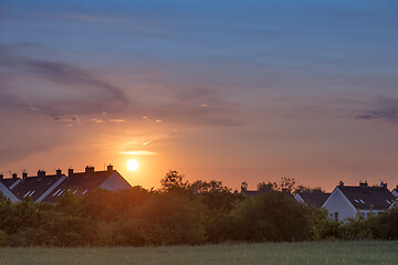 Image showing Houses and trees at sunset