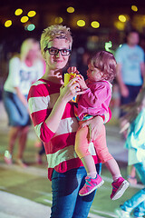 Image showing mother and little daughter in the kids disco