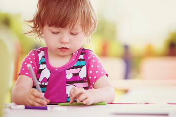 Image showing little girl drawing a colorful pictures