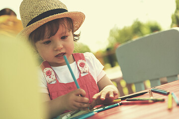 Image showing little girl drawing a colorful pictures