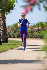 Image showing young female runner training for marathon