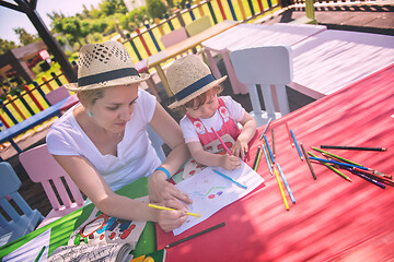 Image showing mom and little daughter drawing a colorful pictures