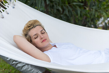 Image showing young woman resting on hammock