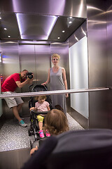 Image showing happy family in the elevator