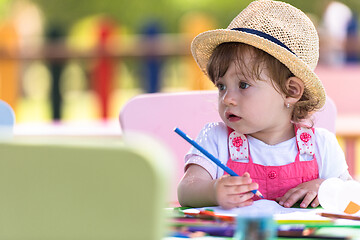 Image showing little girl drawing a colorful pictures