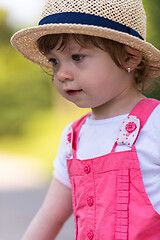 Image showing little girl runing in the summer Park