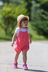 Image showing little girl runing in the summer Park