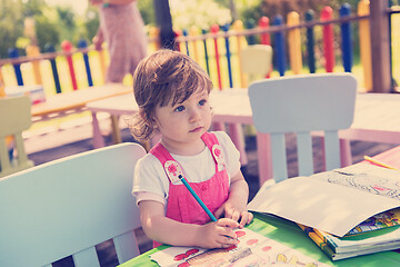 Image showing little girl drawing a colorful pictures