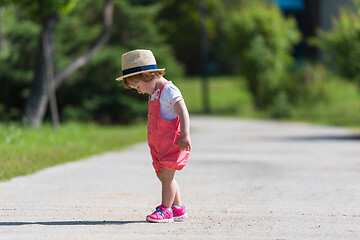 Image showing little girl runing in the summer Park