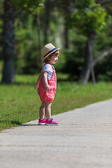 Image showing little girl runing in the summer Park