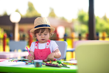 Image showing little girl drawing a colorful pictures