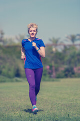 Image showing young female runner training for marathon