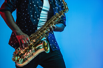 Image showing Young african-american jazz musician playing the saxophone