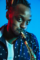 Image showing Young african-american jazz musician playing the saxophone