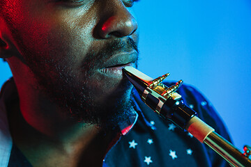 Image showing Young african-american jazz musician playing the saxophone