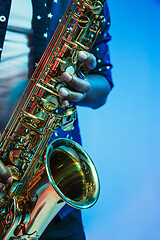 Image showing Young african-american jazz musician playing the saxophone