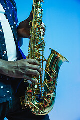 Image showing Young african-american jazz musician playing the saxophone