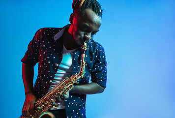 Image showing Young african-american jazz musician playing the saxophone