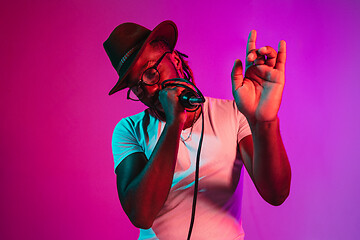 Image showing Young african-american jazz musician singing a song