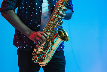 Image showing Young african-american jazz musician playing the saxophone