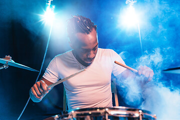 Image showing Young african-american jazz musician playing drums