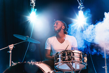 Image showing Young african-american jazz musician playing drums